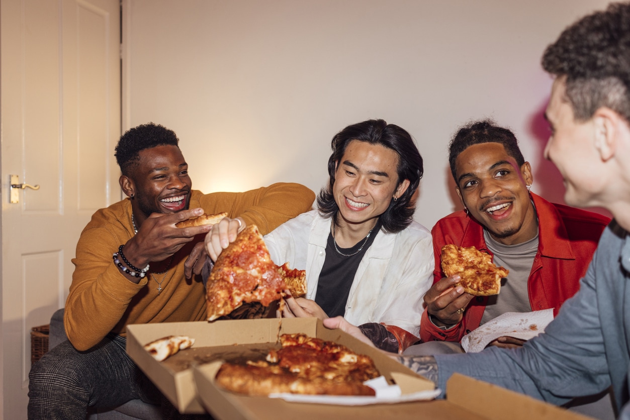 Blog 8 A group of young people enjoying pizza